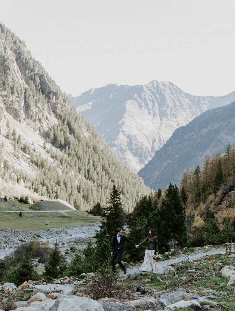Couple hiking on their wedding day