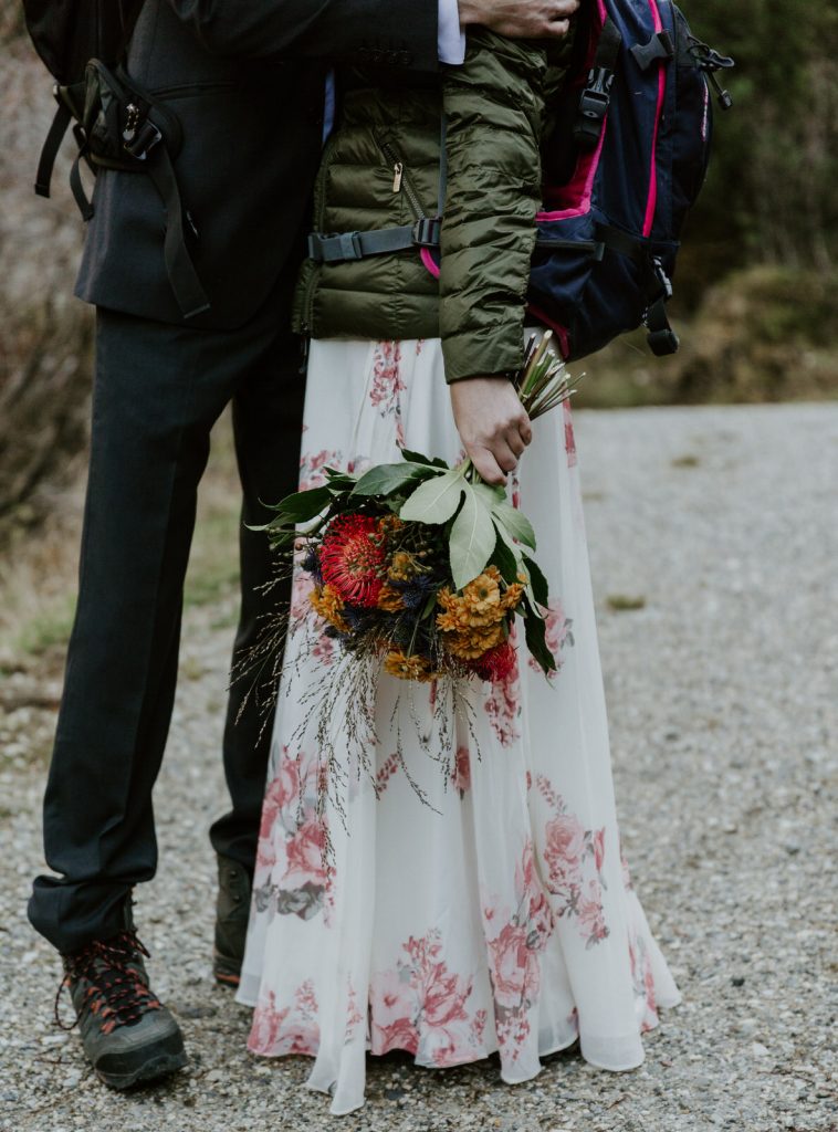 Bride floral dress with flowers on elopement