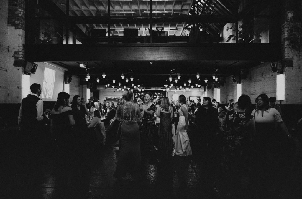 Black and white image of wedding guests at The Mowbray. Sheffield