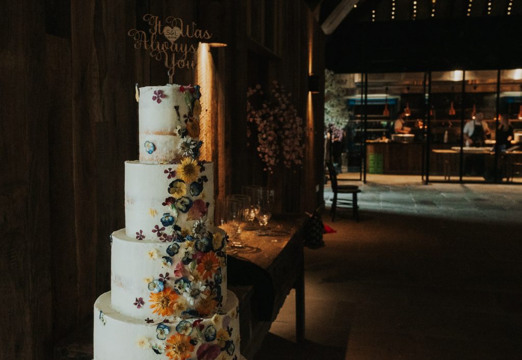 Colourful 4-tier cake at The Tithe Barn, Bolton Abbey