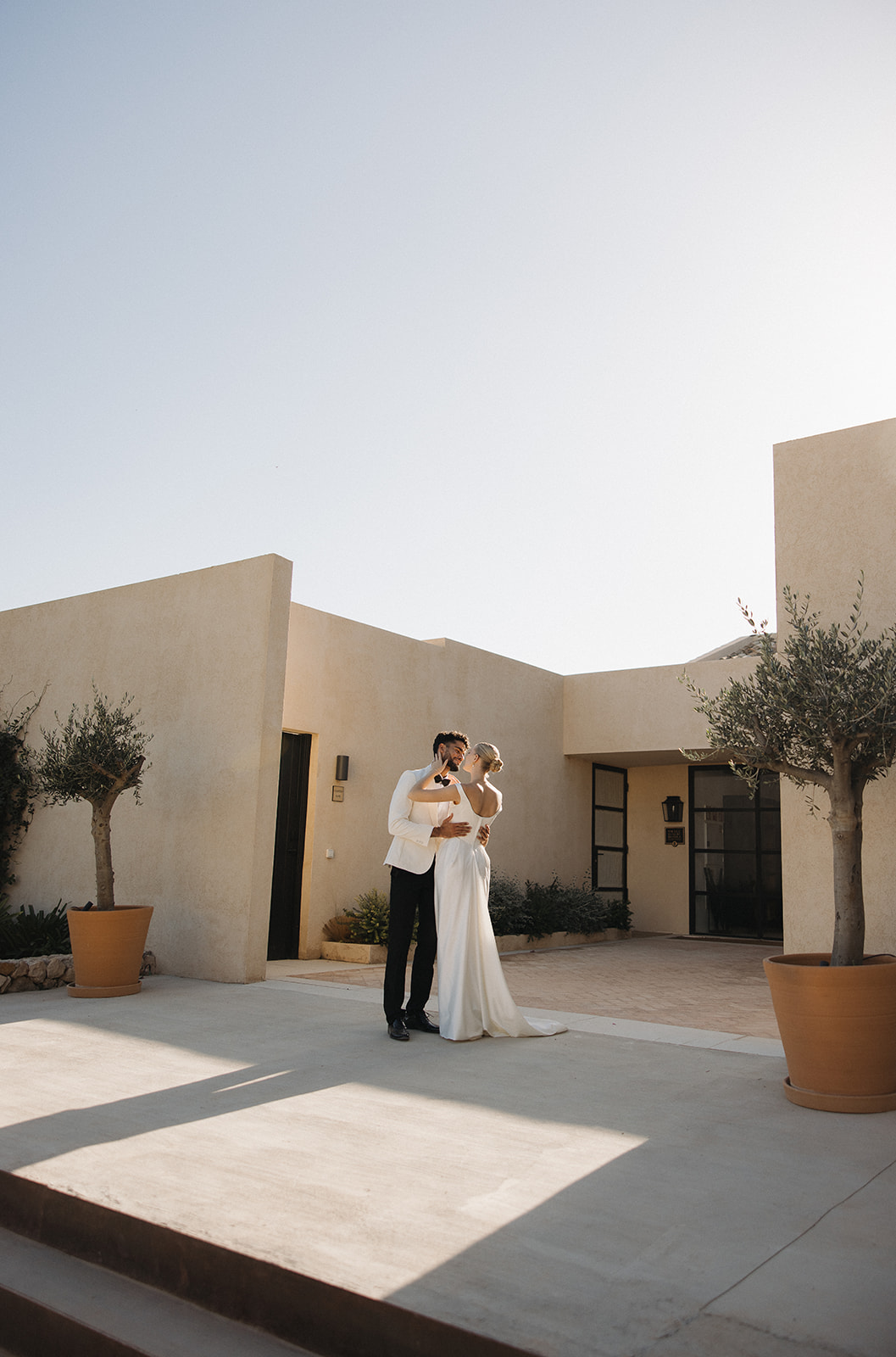 Couple portrait in front of the hotel at The Lodge Mallorca wedding venue