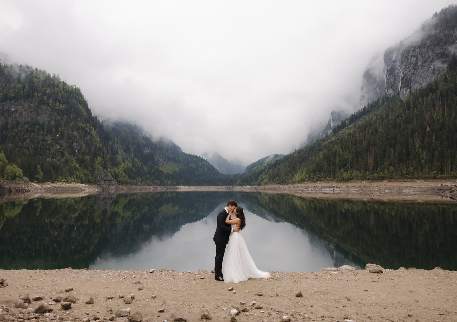 Bride and groom wide shot portrait at Lake Gosausee